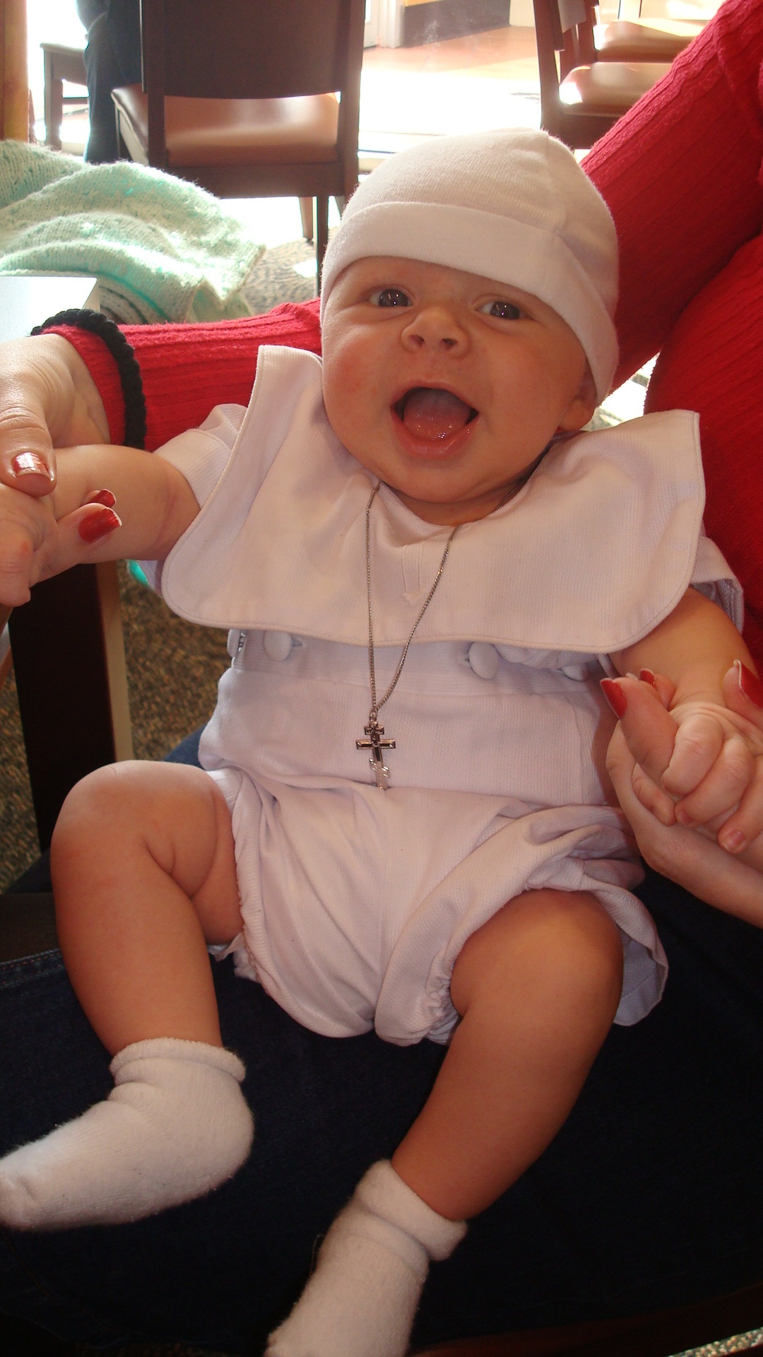 A good Christian picture, featuring his new cross and his baptism clothes