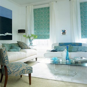 Patterned shades flanked by white curtains and walls- love!